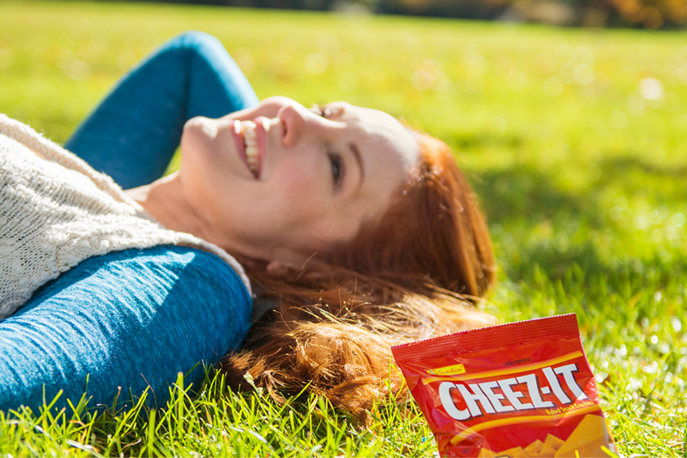 woman laying in the grass